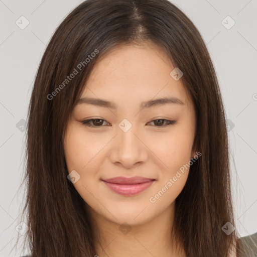 Joyful asian young-adult female with long  brown hair and brown eyes