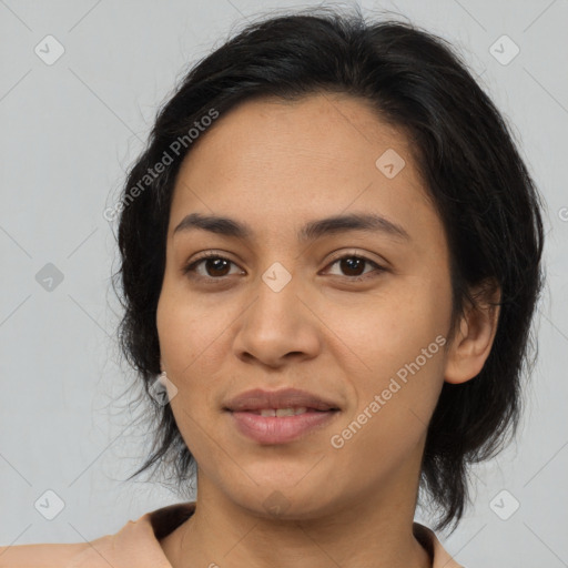 Joyful latino young-adult female with medium  brown hair and brown eyes