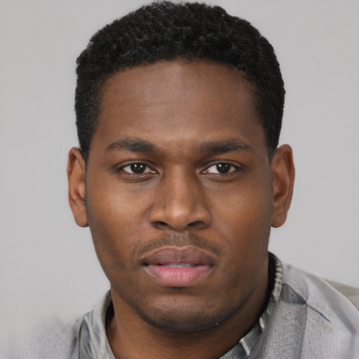 Neutral black young-adult male with short  brown hair and brown eyes