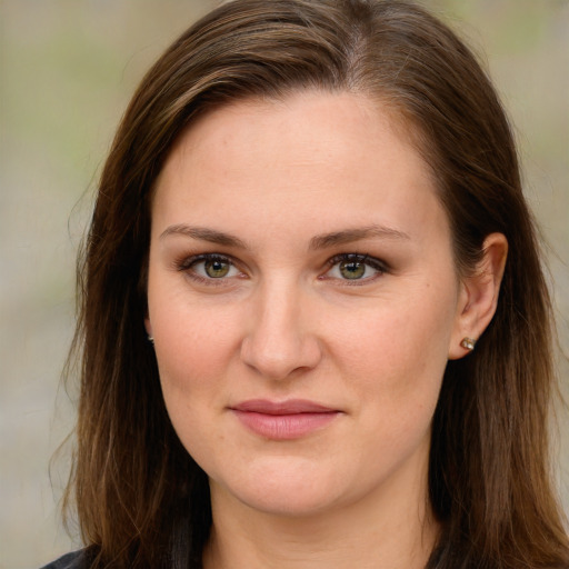 Joyful white young-adult female with long  brown hair and green eyes