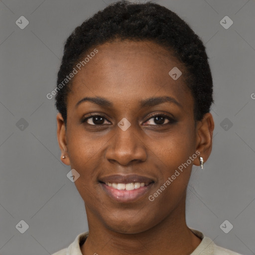 Joyful black young-adult female with short  black hair and brown eyes