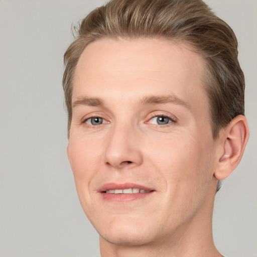 Joyful white adult male with short  brown hair and grey eyes