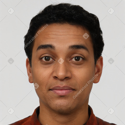 Joyful latino young-adult male with short  brown hair and brown eyes