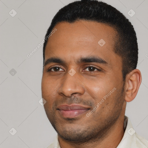 Joyful black young-adult male with short  black hair and brown eyes