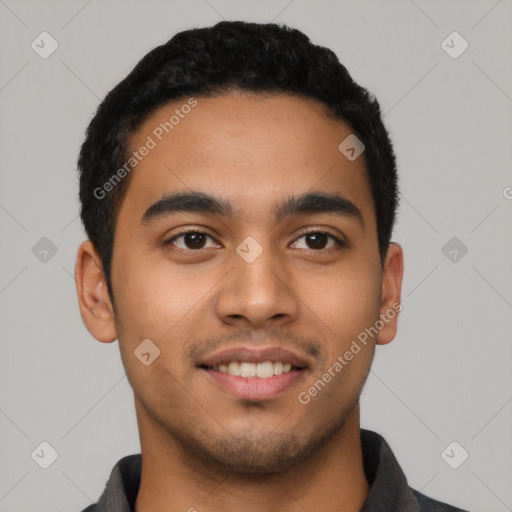 Joyful latino young-adult male with short  black hair and brown eyes