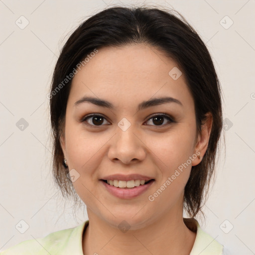 Joyful latino young-adult female with medium  brown hair and brown eyes