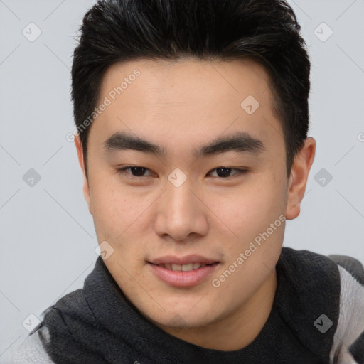 Joyful asian young-adult male with short  brown hair and brown eyes