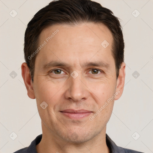 Joyful white adult male with short  brown hair and brown eyes