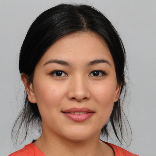 Joyful asian young-adult female with medium  black hair and brown eyes