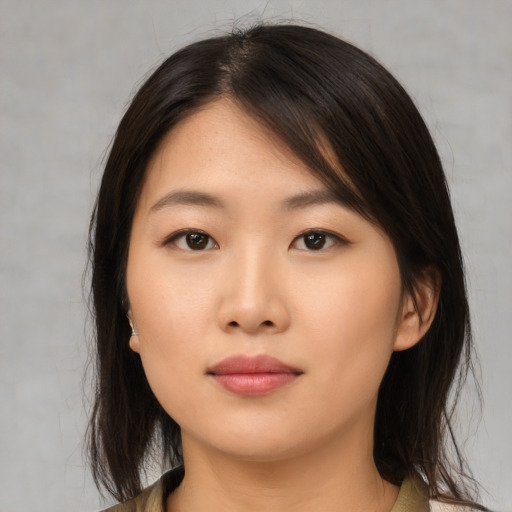 Neutral asian young-adult female with medium  brown hair and brown eyes