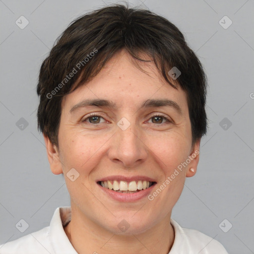 Joyful white adult female with short  brown hair and brown eyes