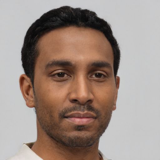 Neutral latino young-adult male with short  black hair and brown eyes