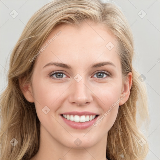 Joyful white young-adult female with long  brown hair and blue eyes