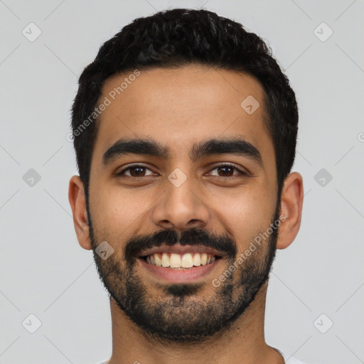 Joyful latino young-adult male with short  black hair and brown eyes