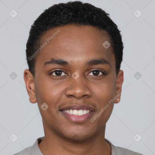 Joyful black young-adult male with short  brown hair and brown eyes