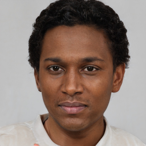 Neutral black young-adult male with short  black hair and brown eyes