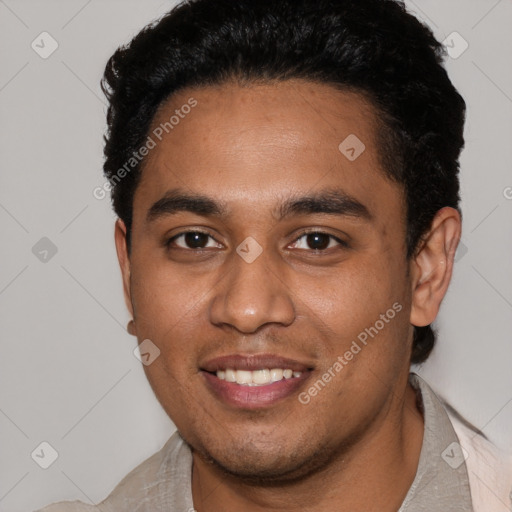 Joyful black young-adult male with short  black hair and brown eyes