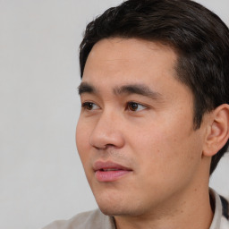 Neutral white young-adult male with short  black hair and brown eyes