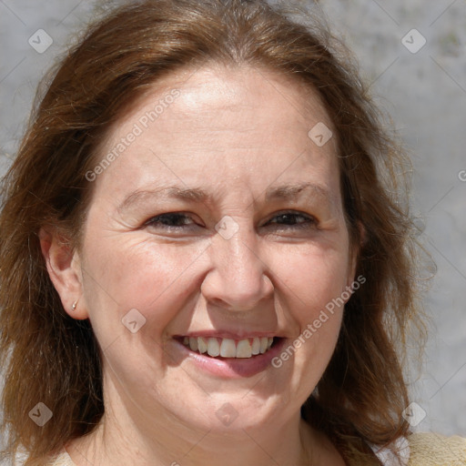 Joyful white adult female with medium  brown hair and grey eyes