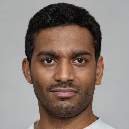 Neutral black young-adult male with short  black hair and brown eyes