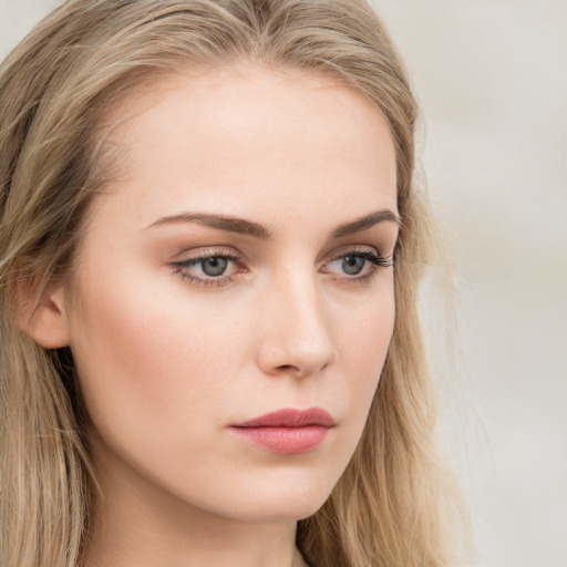 Neutral white young-adult female with long  brown hair and blue eyes