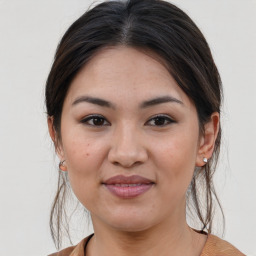 Joyful white young-adult female with medium  brown hair and brown eyes