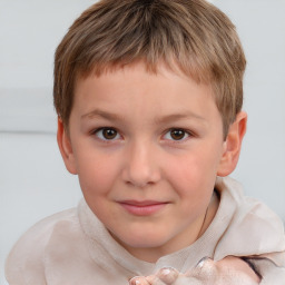 Joyful white child male with short  brown hair and brown eyes