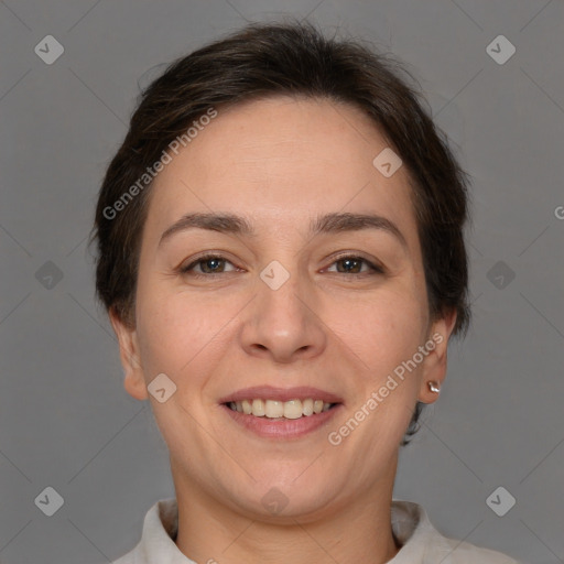 Joyful white adult female with short  brown hair and brown eyes