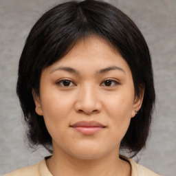 Joyful asian young-adult female with medium  brown hair and brown eyes