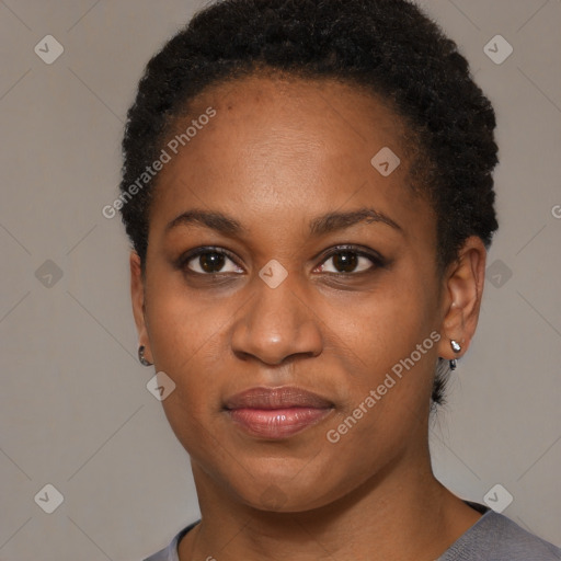 Joyful black young-adult female with short  brown hair and brown eyes