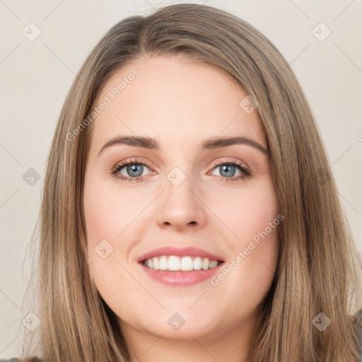 Joyful white young-adult female with long  brown hair and green eyes