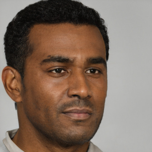 Neutral black young-adult male with short  brown hair and brown eyes