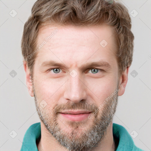 Joyful white adult male with short  brown hair and grey eyes