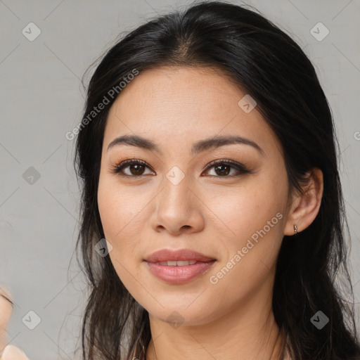 Joyful asian young-adult female with long  brown hair and brown eyes