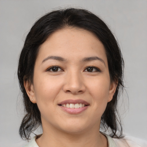 Joyful white young-adult female with medium  brown hair and brown eyes