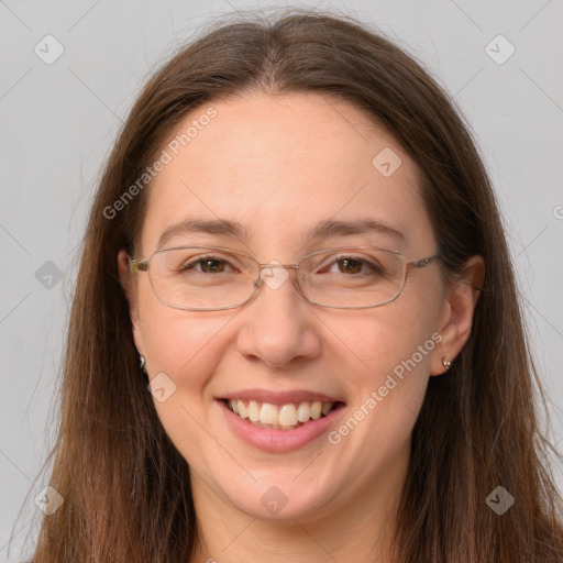 Joyful white adult female with long  brown hair and grey eyes