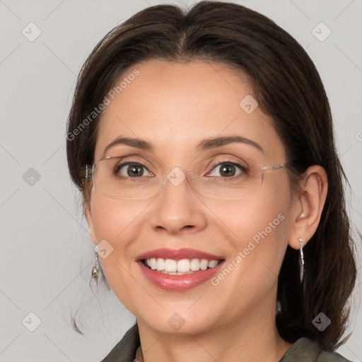 Joyful white adult female with medium  brown hair and brown eyes