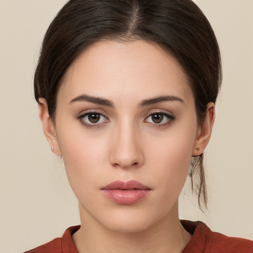 Neutral white young-adult female with medium  brown hair and brown eyes