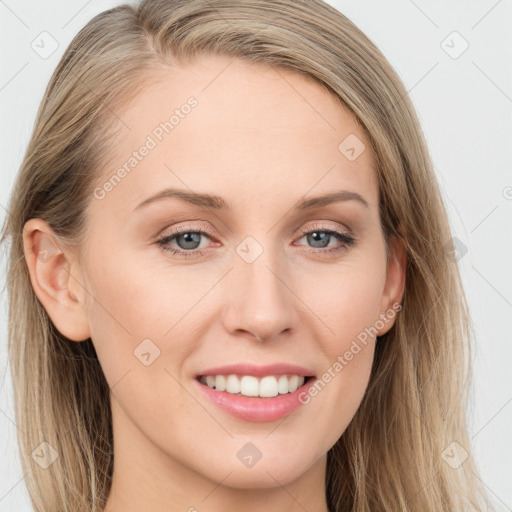 Joyful white young-adult female with long  brown hair and blue eyes