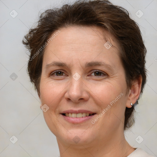 Joyful white adult female with short  brown hair and brown eyes