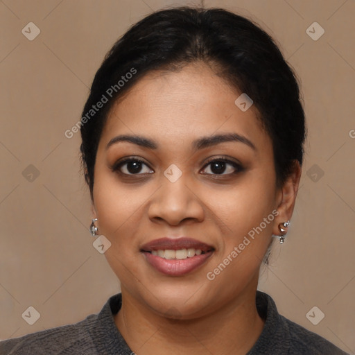 Joyful latino young-adult female with medium  black hair and brown eyes