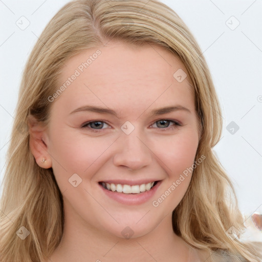 Joyful white young-adult female with long  brown hair and blue eyes