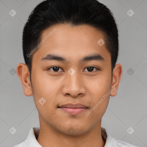 Joyful asian young-adult male with short  brown hair and brown eyes