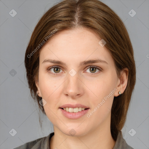 Joyful white young-adult female with medium  brown hair and grey eyes