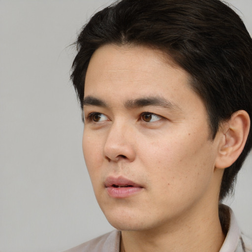 Neutral white young-adult male with short  black hair and brown eyes