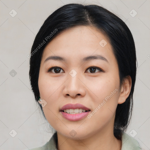 Joyful asian young-adult female with medium  black hair and brown eyes