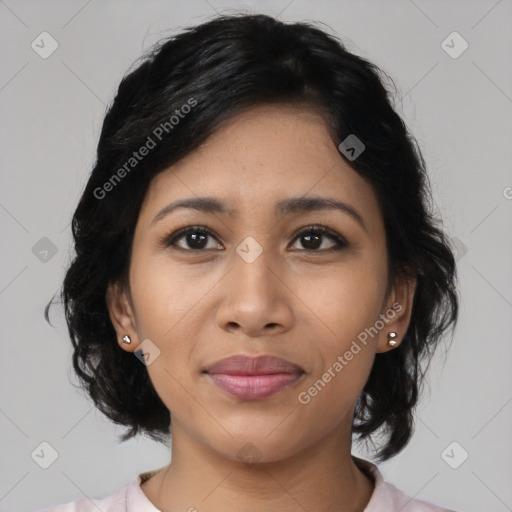 Joyful latino young-adult female with medium  black hair and brown eyes