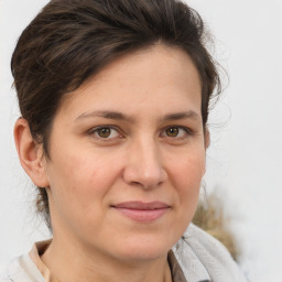 Joyful white adult female with short  brown hair and brown eyes