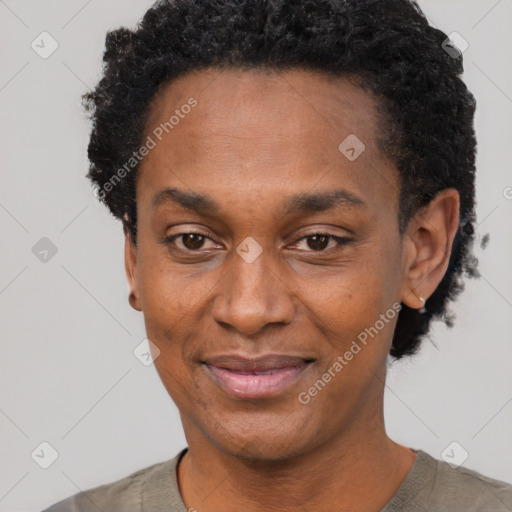 Joyful black adult male with short  black hair and brown eyes