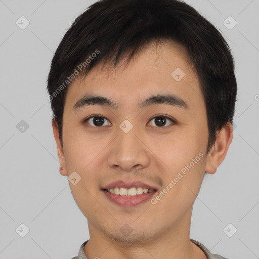 Joyful asian young-adult male with short  brown hair and brown eyes